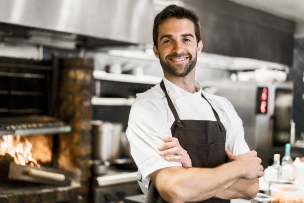 Chef standing with arms folded